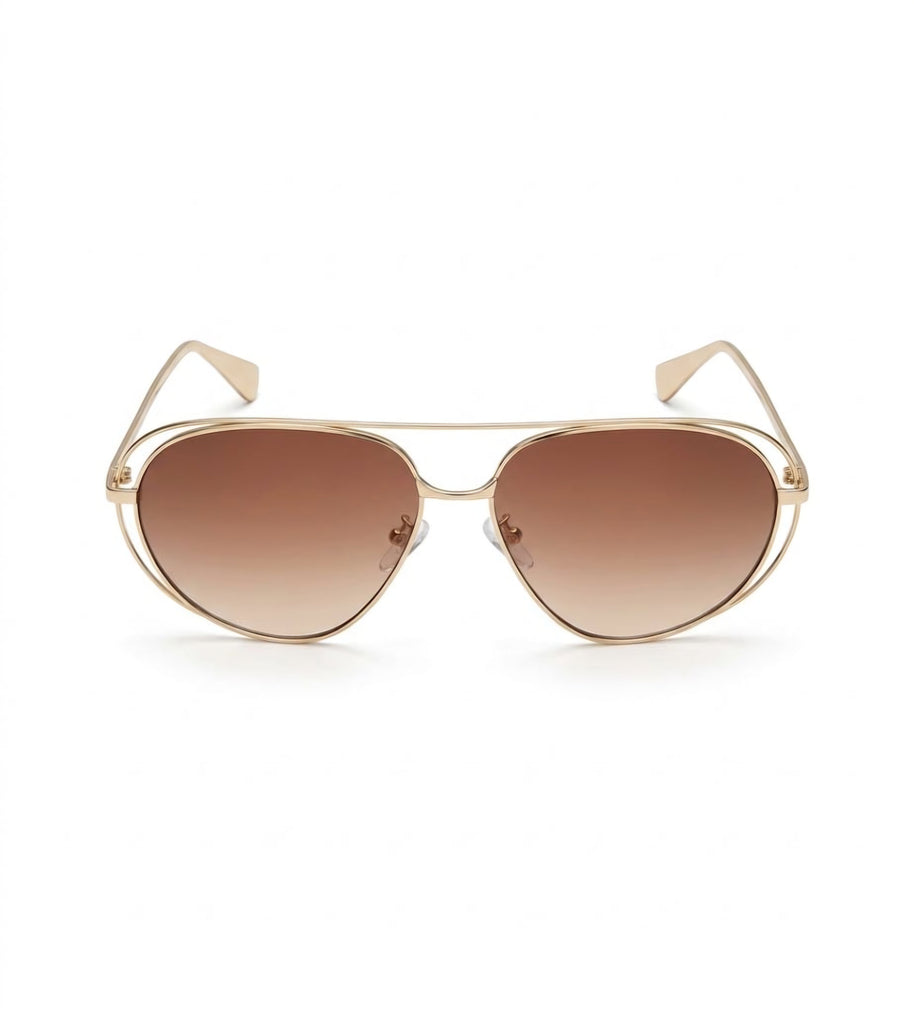 Óculos de sol Madë Glasses Évora estilo aviador com armação metálica dourada e lentes degradê marrons.